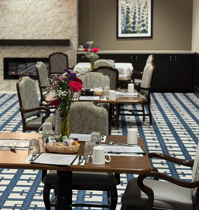 dining room featuring blue and white carpeting that adds a fresh touch to the space.